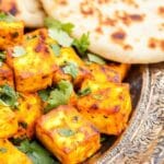 Tandoori Pumpkin Paneer served with naan and chutneys.