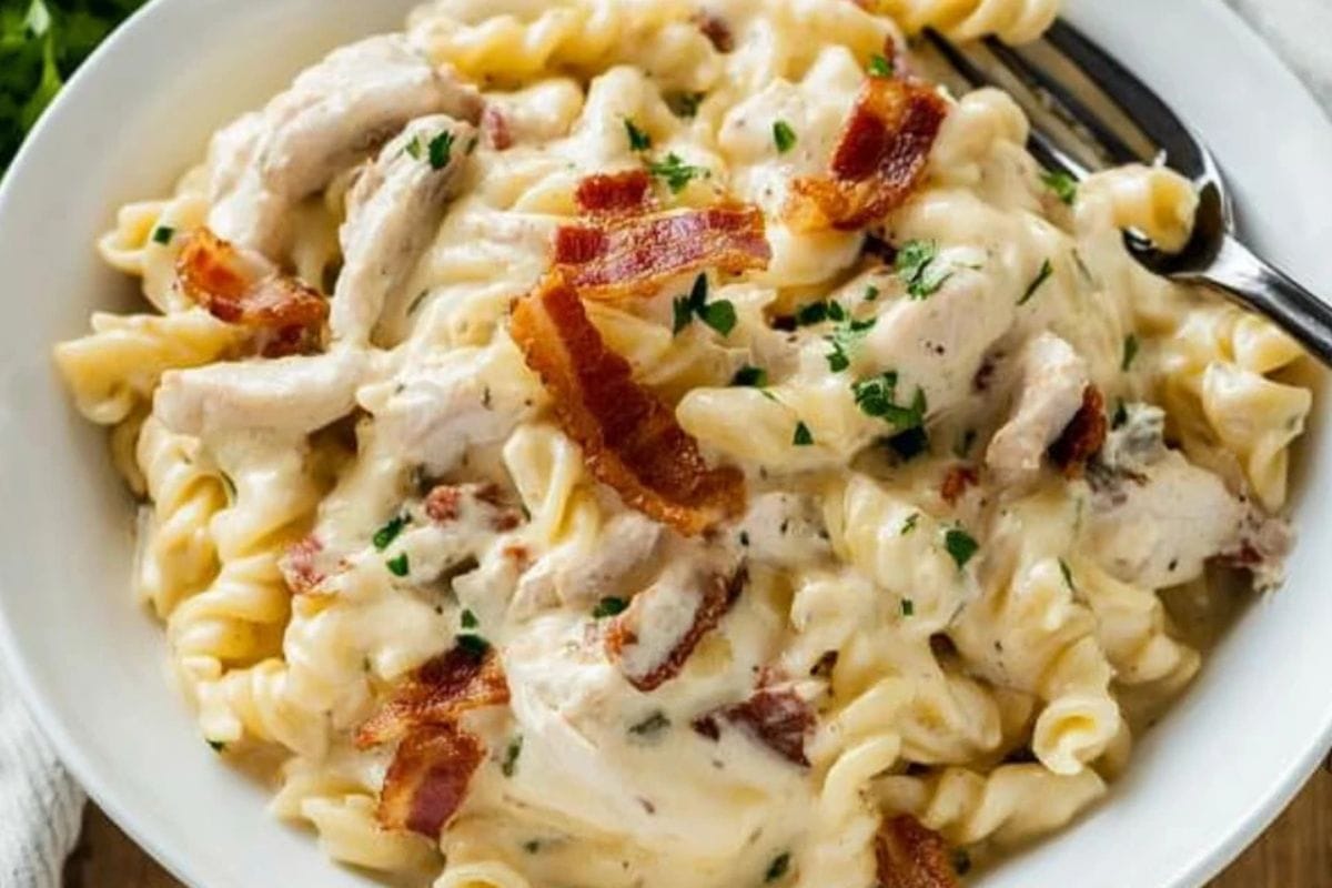 Creamy Chicken Bacon Ranch Pasta in a bowl garnished with fresh parsley.