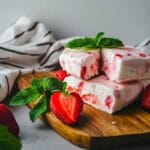 Strawberry ice cream bars with fresh strawberries and mint leaves